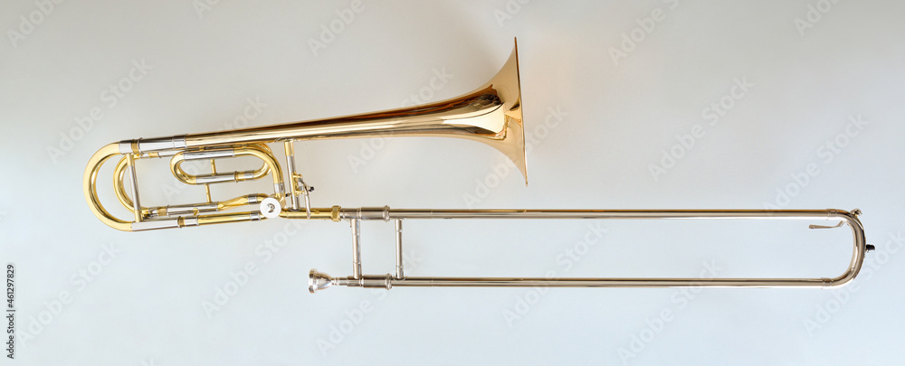 Obraz premium Trombone with transposer mounted on a white table top view