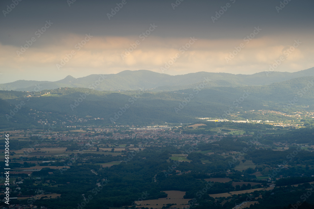 panoramic town of la garriga with summer storm black clouds, catalonia spain