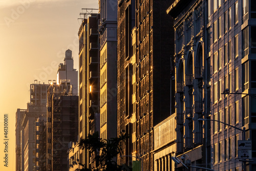 Photography Block of historic buildings in New York City with the warm light of sunset casti