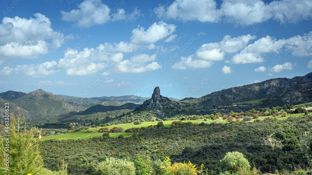 Panoramic view of the river Sirkatis valley with the impressive standalone rock of Kourvellos in the middle (Lefkara area, Cyprus)