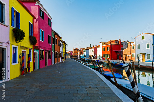 Italy. Veneto, Burano. Coloured houses along canal in Burano village © BTWImages