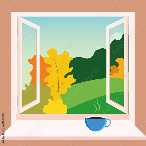 Autumn window view with cup of hot tea