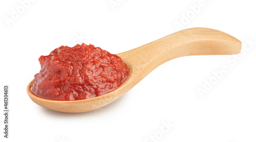 natural tomato paste in wooden spoon isolated on white.