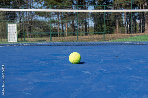Concrete blue tennis court with ball © fotosr52