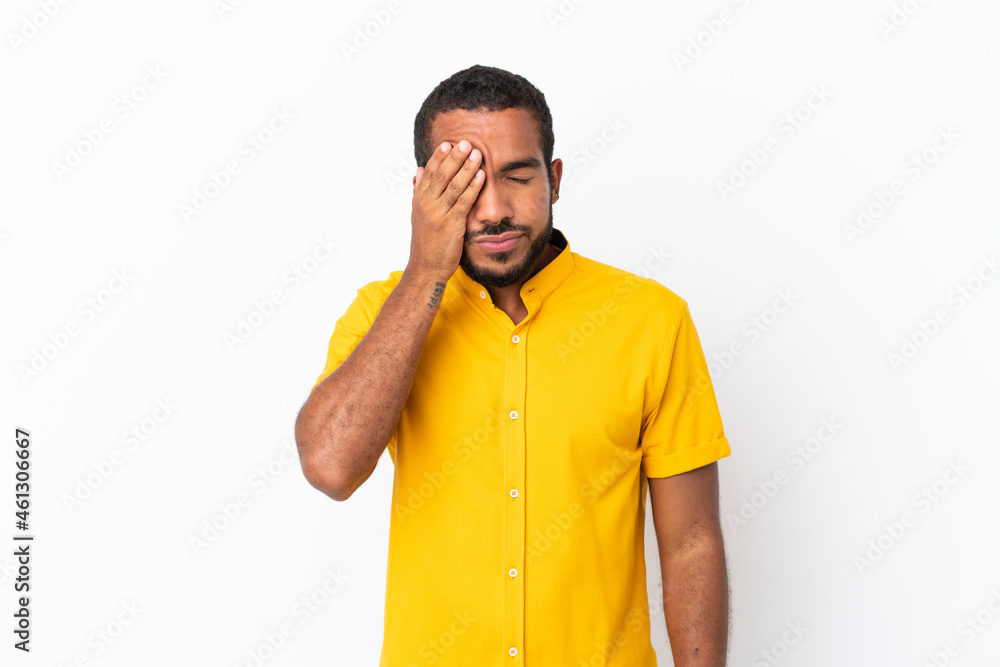 Young Ecuadorian man isolated on white background with headache Young Ecuadorian man isolated on white background with headache