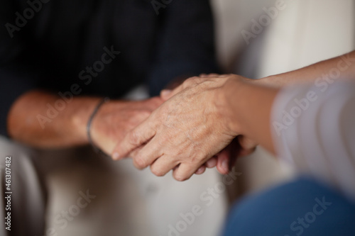 Cancer diagnosis. Hands holding other hands. Consultation with a psychologist. Hope and kindness.