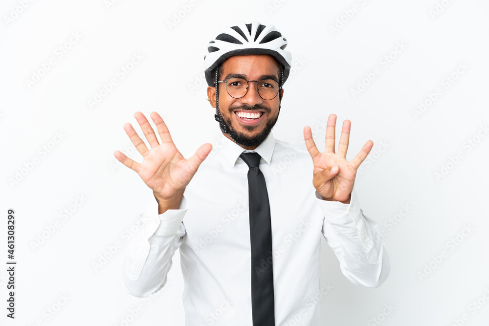 Young business latin man holding a bike helmet isolated on white background counting nine with fingers Young business latin man holding a bike helmet isolated on white background counting nine with fingers