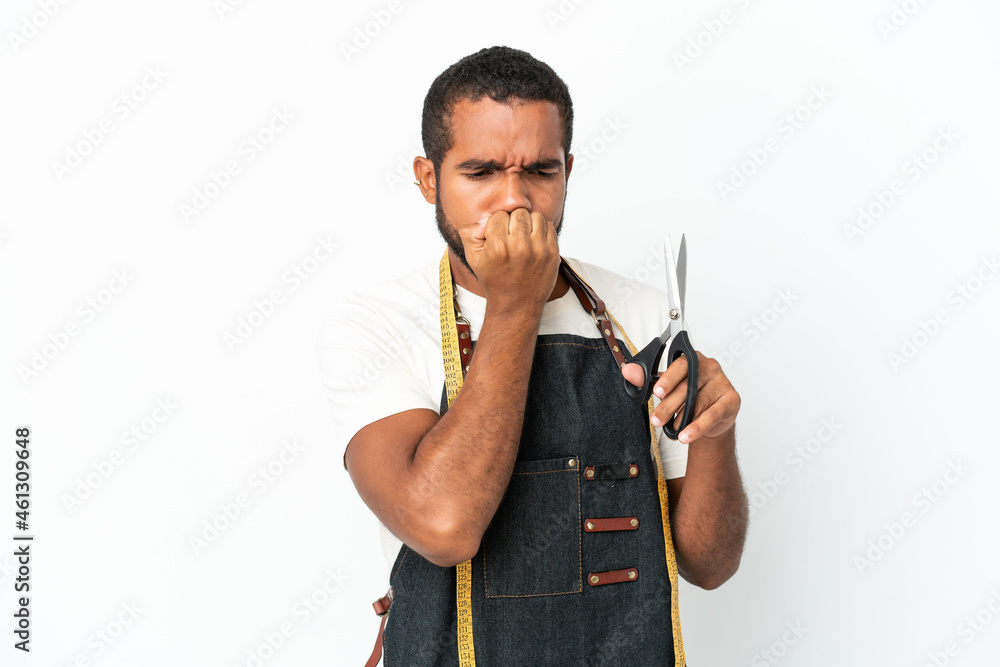 Young Ecuadorian design man holding scissors isolated on white background having doubts Young Ecuadorian design man holding scissors isolated on white background having doubts
