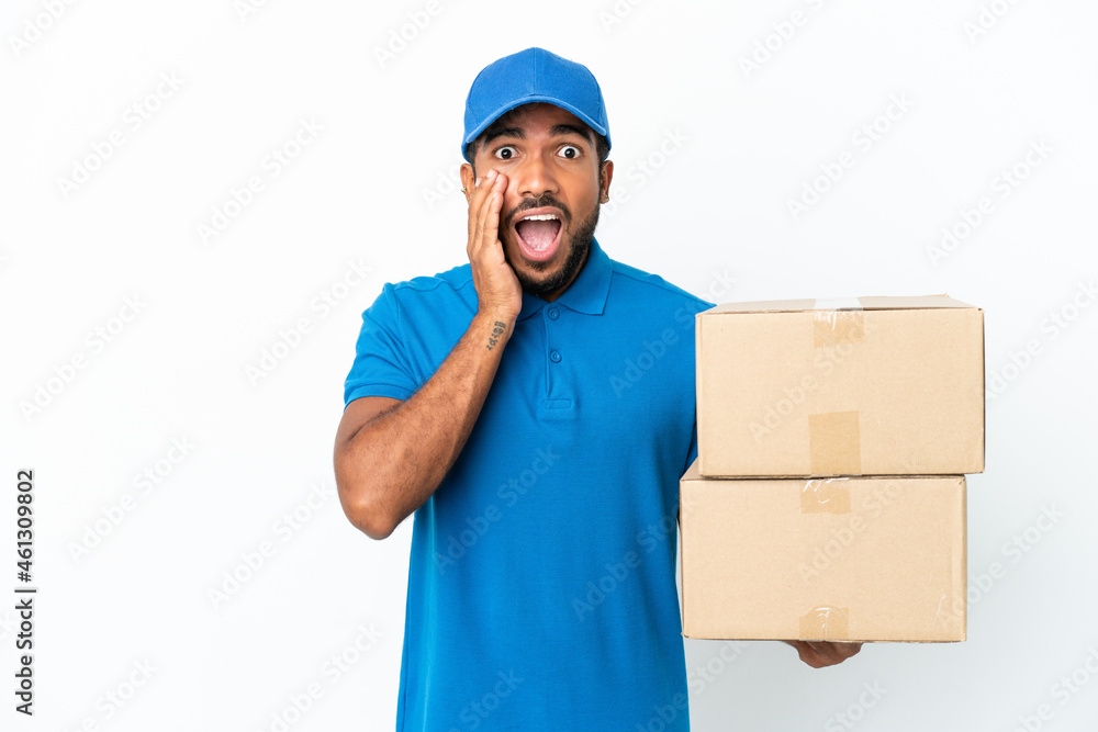 Delivery Ecuadorian man isolated on white background with surprise and shocked facial expression Delivery Ecuadorian man isolated on white background with surprise and shocked facial expression