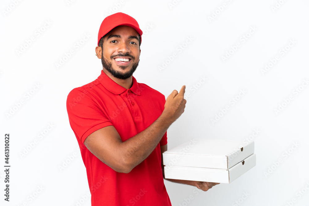 pizza delivery man picking up pizza boxes isolated on white background pointing back pizza delivery man picking up pizza boxes isolated on white background pointing back