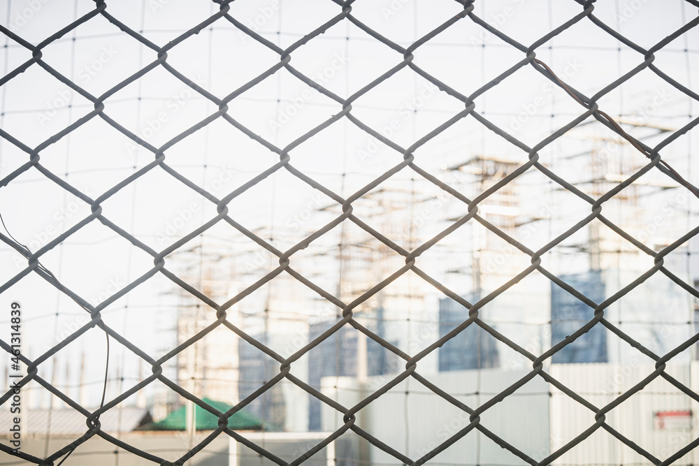 Fototapeta premium Close-up chain link fence , Sunset background