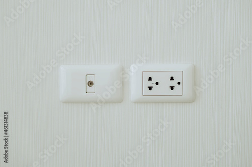 Electrical switch on white wall background