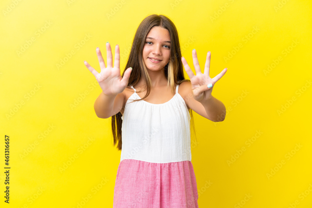 Little caucasian girl isolated on yellow background counting nine with fingers Little caucasian girl isolated on yellow background counting nine with fingers