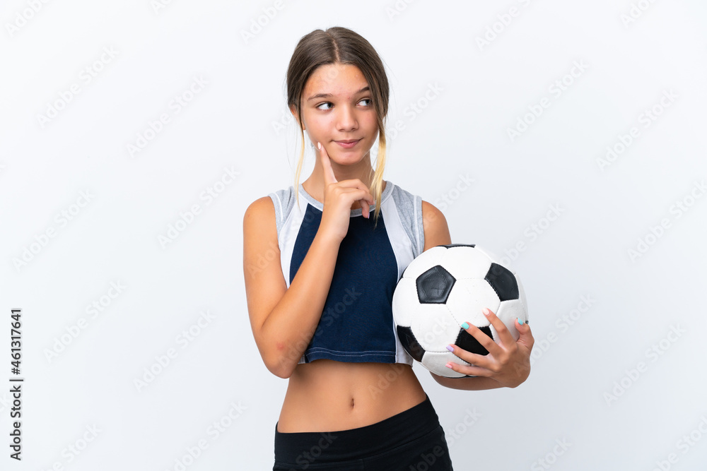 Little caucasian girl playing football isolated on white background thinking an idea while looking up Little caucasian girl playing football isolated on white background thinking an idea while looking up