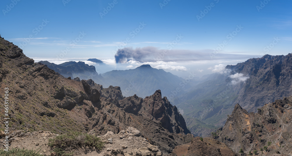 Panoramic view of Cumbre vieja from Caldera de Taburiente. Volcano smoke above the clouds. La Palma. Canary Islands Panoramic view of Cumbre vieja from Caldera de Taburiente. Volcano smoke above the clouds. La Palma. Canary Islands