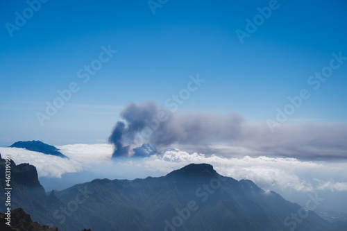 view of Cumbre vieja from Caldera de Taburiente. Volcano smoke above the clouds. La Palma. Canary Islands