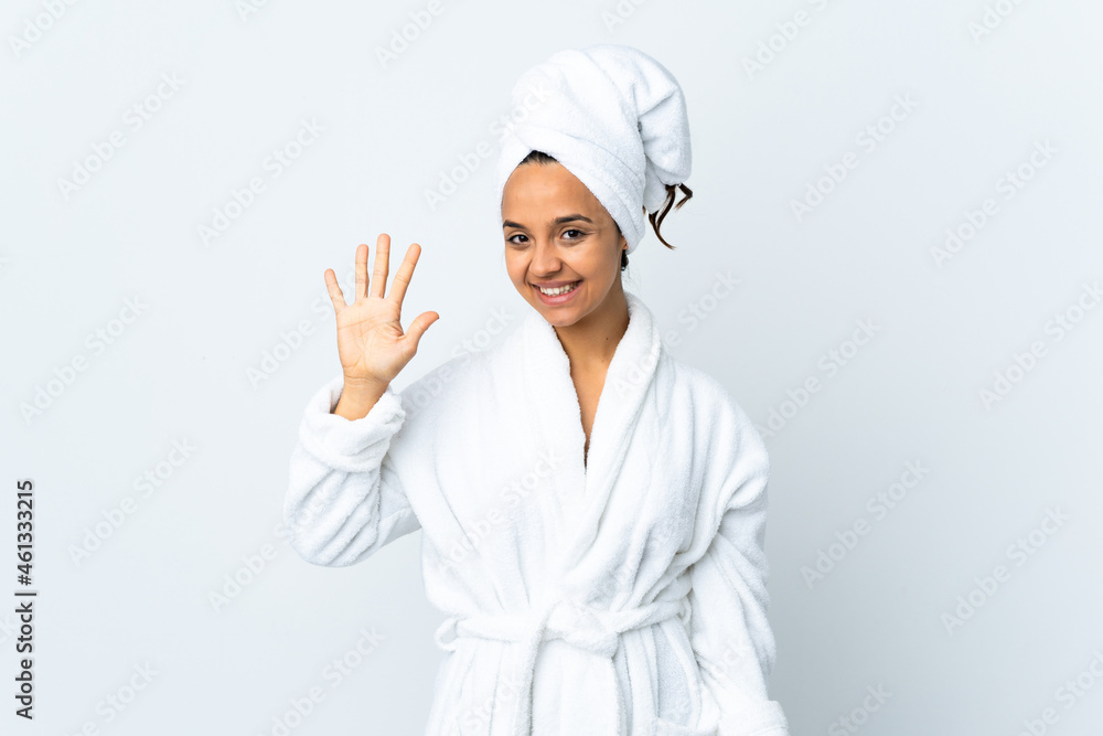 Young woman in bathrobe over isolated white background counting five with fingers Young woman in bathrobe over isolated white background counting five with fingers