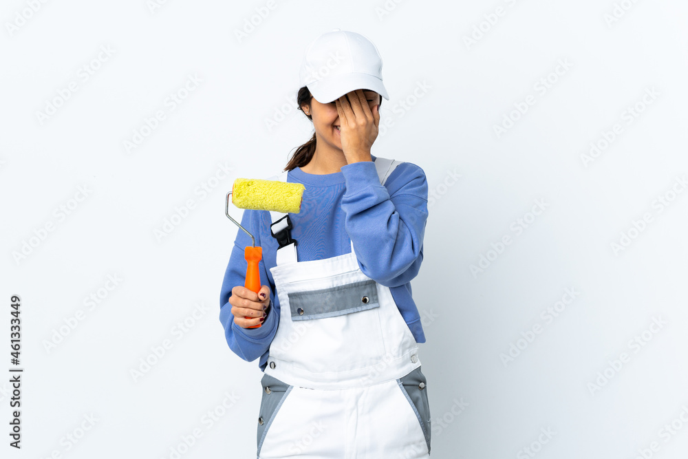 Painter woman over isolated white background covering eyes by hands Painter woman over isolated white background covering eyes by hands