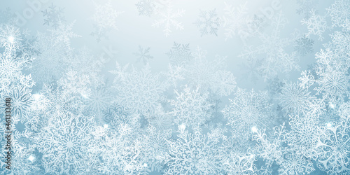 Christmas background of big complex snowflakes in light blue colors