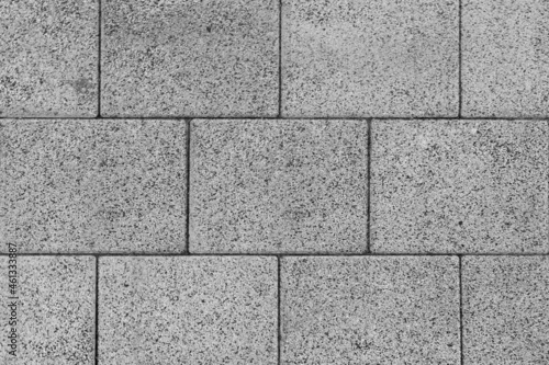 The texture of the large gray brick blocks lined up in layers. Or as a brick block used in construction can be used as a background in architecture or house building.
