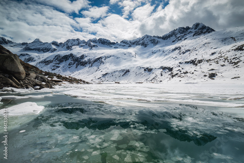 Broken Ice in the Waters of Dosazzo Lake during Spring, Adamello park, Lombardia, Italy