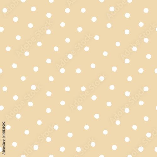 Seamless pattern of white rough polka dot on beige background. For textile, wrapping paper, wallpaper, interior decoration, packaging and stationery design.