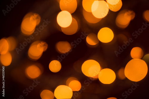 Abstract shimmering background with lights. Defocused golden bokeh lights. Valentine's Day, Christmas, New Year background. © екатерина лагунова