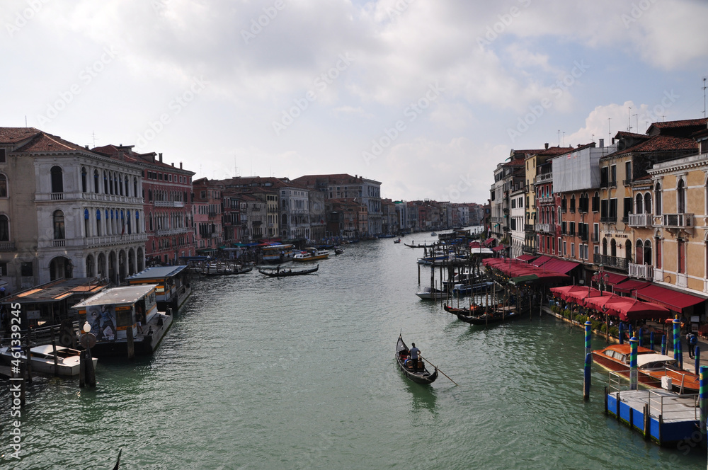 Panoramic view of the canal with a pier along the embankment. Gondolas float along the canal. ... October 11, 2014, Venice, Italy