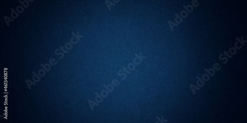Dark blue background texture with black vignette in old vintage grunge textured border design, dark elegant teal color wall with light spotlight center