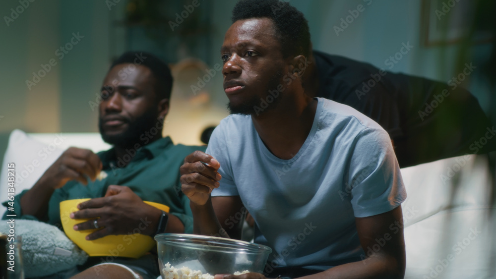 Happy black man celebrating victory of favorite team with friends Stock ...