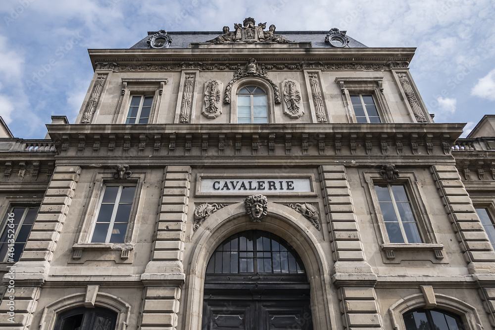 Architectural fragment of the facade of the military school (Ecole Militaire) founded in 1750 in Paris. Cavalry (Cavalerie) building. Paris, France.