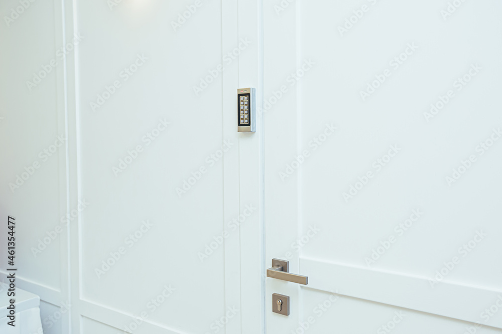 Door with coded lock in the middle of the room in white Door with coded lock in the middle of the room in white