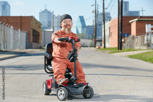 Portrait of male dwarf in the street in Texas looking into camera with tough attitude.  photo