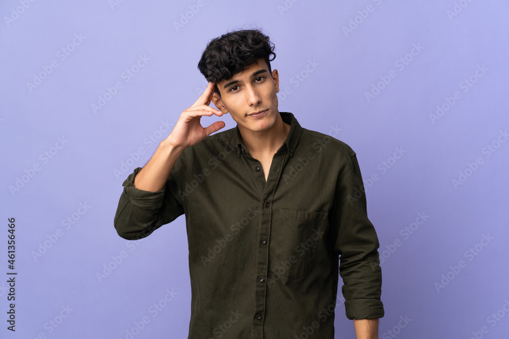 Young Argentinian man isolated on background thinking an idea Young Argentinian man isolated on background thinking an idea