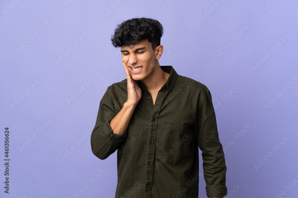 Young Argentinian man isolated on background with toothache Young Argentinian man isolated on background with toothache