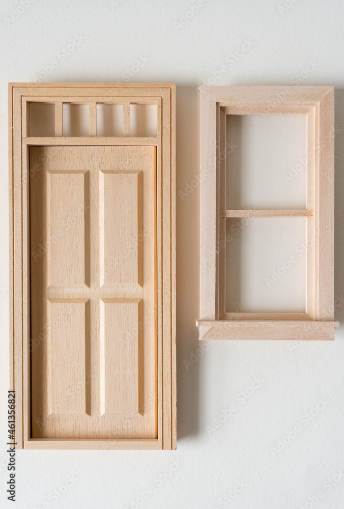 miniature door and window on a paper background