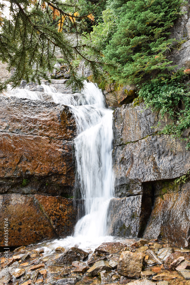 Fototapeta premium Long exposure small waterfall in mountains