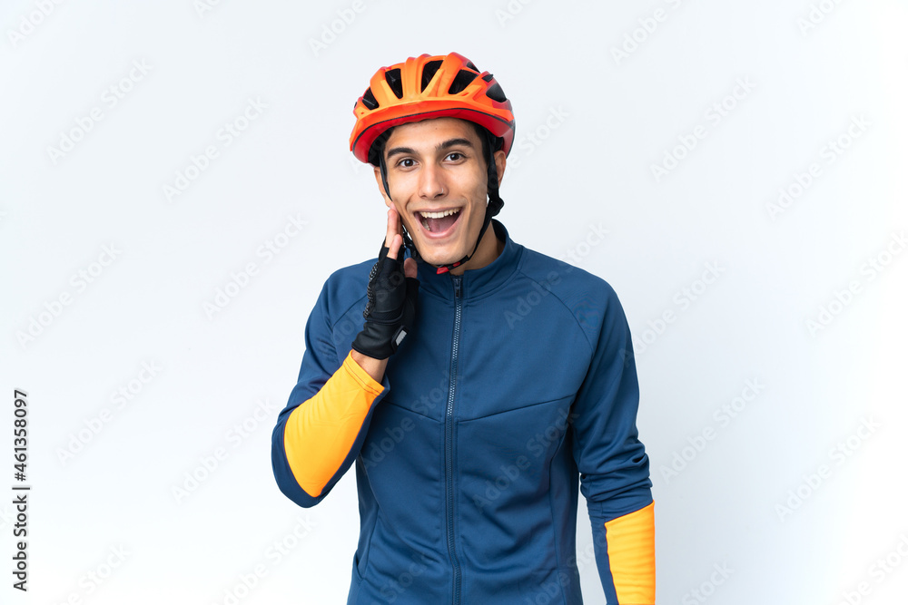 Young cyclist man isolated on background with surprise and shocked facial expression Young cyclist man isolated on background with surprise and shocked facial expression