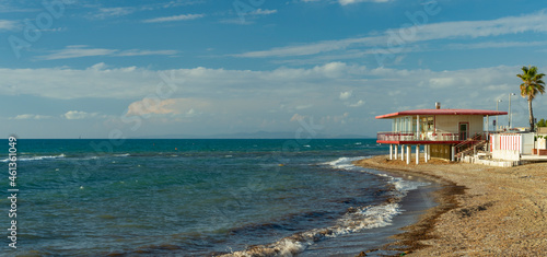 Panorama of the Tuscan coast with a bathhouse and a beach with natural posidonia algae © Franco Tognarini