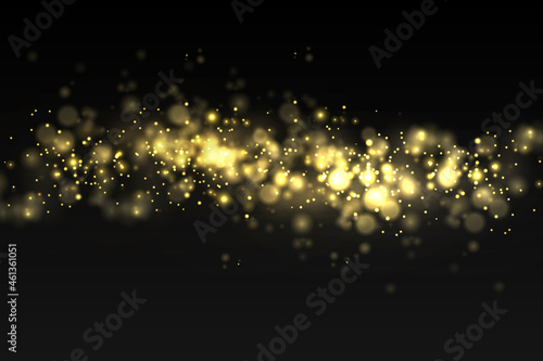 Sparkling golden magic dust particles bokeh light.