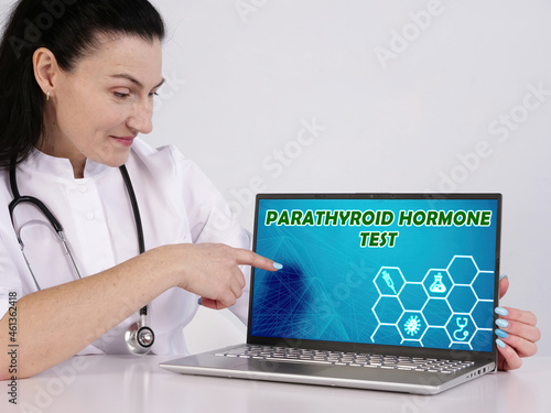 PTH PARATHYROID HORMONE TEST phrase on the screen. therapist use internet technologies at office. photo