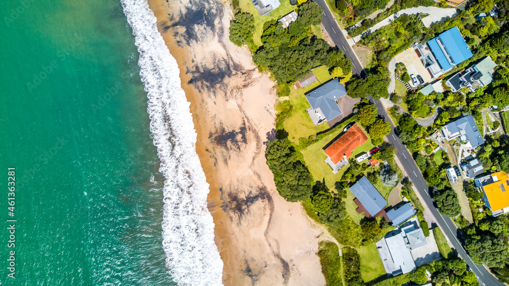 Fototapeta premium Residential houses on the sunny beach. North Island, New Zealand.
