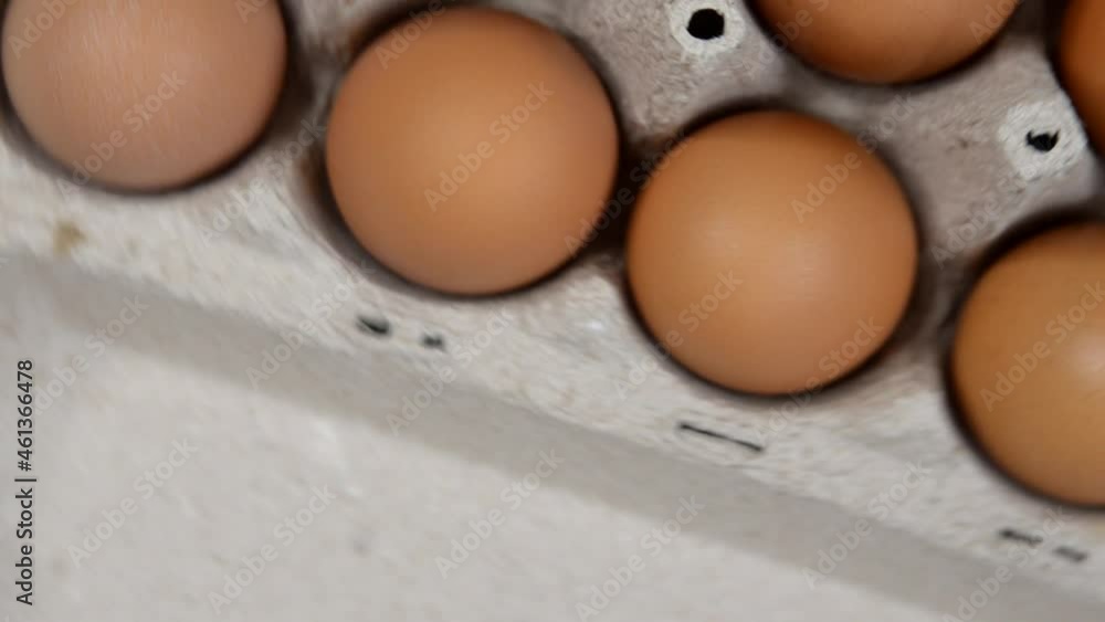 fresh homemade farm eggs in eco packaging on a concrete table, the concept of delivery and packaging of organic products fresh homemade farm eggs in eco packaging on a concrete table, the concept of delivery and packaging of organic products