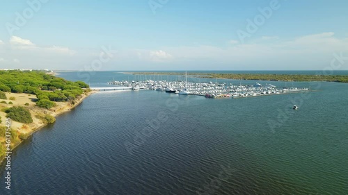 Boats Moored At Marina Nuevo Portil By Piedra River With Verdant Forest On Riverbank Near El Rompido In Huelva, Spain. - aerial photo