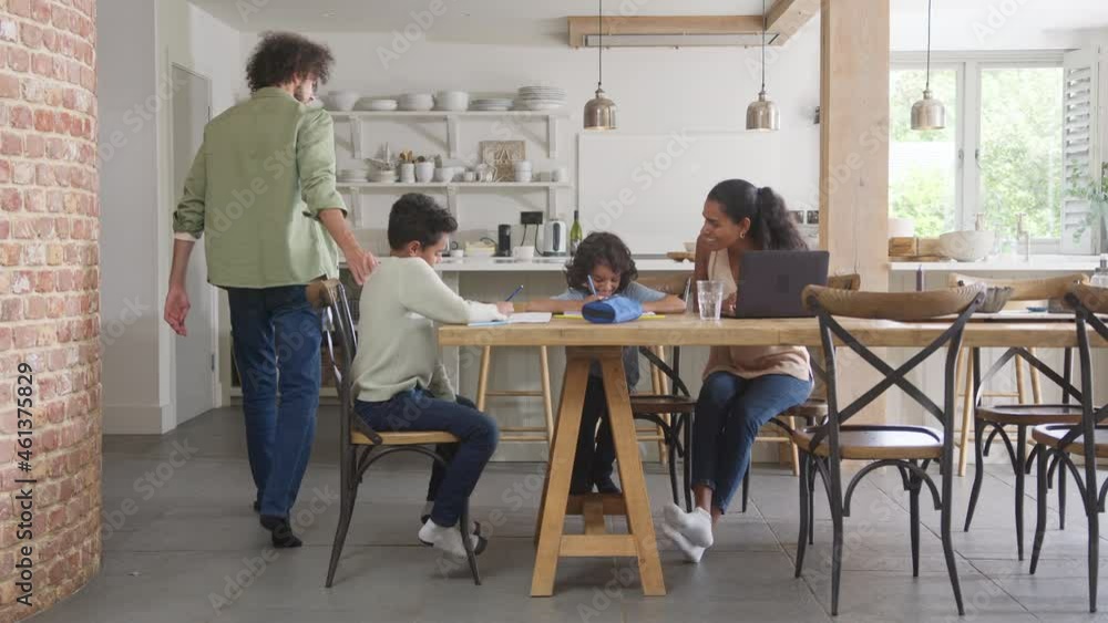 Slow motion of boys doing homework and working mother Slow motion of boys doing homework and working mother