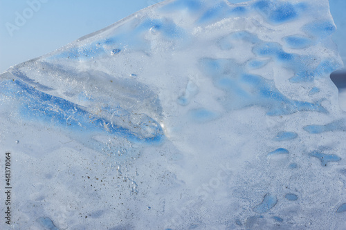 frozen large block of ice with a blue tint. beautiful ice floe