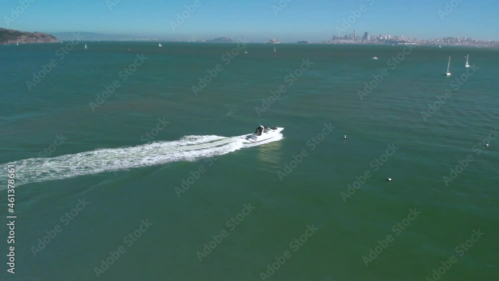 Circling around a boat in Sausalito Harbor revealing San Francisco and the Golden Gate Bridge in the background Circling around a boat in Sausalito Harbor revealing San Francisco and the Golden Gate Bridge in the background