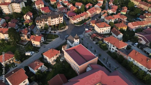 Pljevlja Town, Montenegro, Aerial View of Sveta Petka Orthodox Church, Buildings and Cityscape at Evening Summer Sun, Drone Shot photo