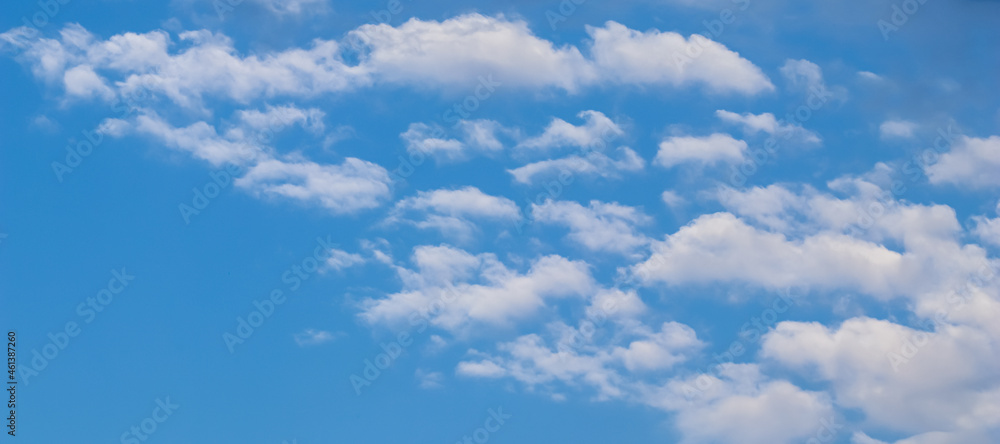Fototapeta premium Background of blue sky with beautiful natural white clouds.