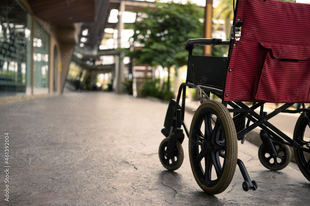 Empty wheelchair parked in hospital. Health care and insurance concept. Empty wheelchair parked in hospital. Health care and insurance concept.